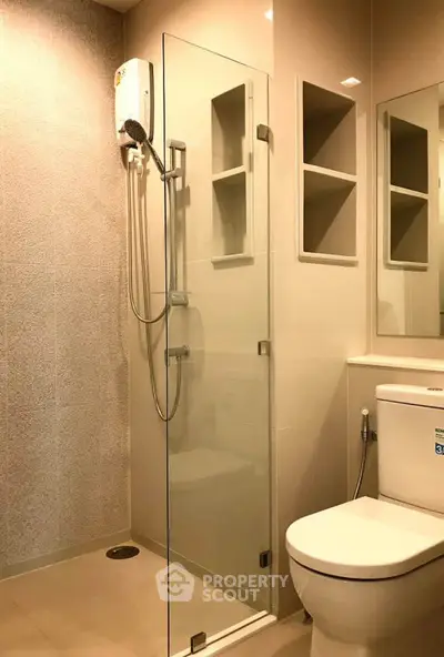 Modern bathroom with glass shower and sleek fixtures