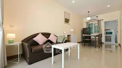 Modern living room with sleek furniture and open kitchen layout