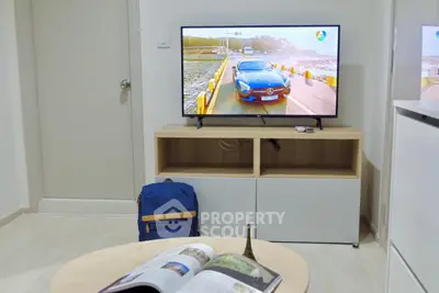 Modern living room with sleek TV setup and stylish furniture