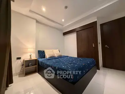 Modern bedroom with stylish decor and cozy lighting