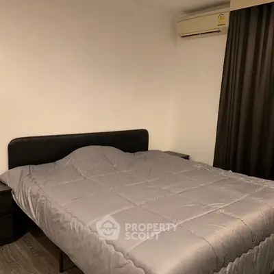 Cozy bedroom with modern decor and air conditioning, perfect for restful nights.