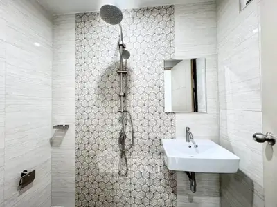 Modern bathroom with stylish tile design and sleek fixtures