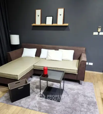 Modern living room with stylish sofa and decor on wooden flooring