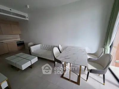 Modern living room with elegant white furniture and marble dining table