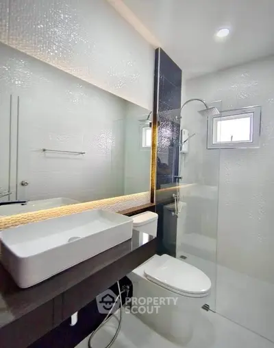 Modern bathroom with sleek design and glass shower enclosure