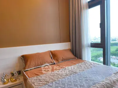 Cozy bedroom with large window offering scenic views, featuring elegant decor and warm lighting.