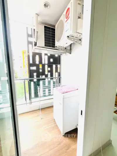 Modern balcony with washing machine and air conditioning unit