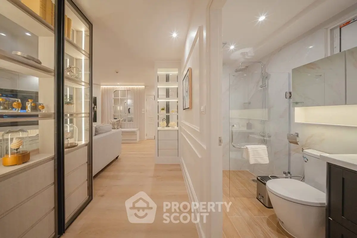Luxurious modern apartment interior with open living room and elegant bathroom design.