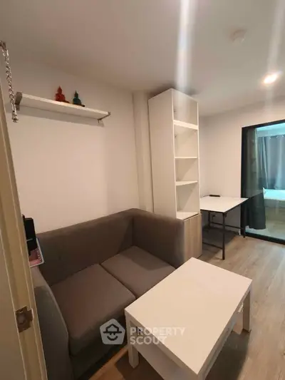 Cozy living room with modern furniture and open layout, perfect for urban living.