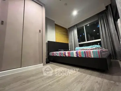 Modern bedroom with stylish decor and large window view