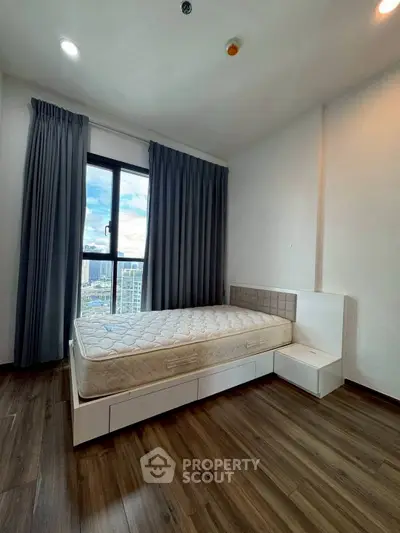 Spacious bedroom with city view and modern furnishings