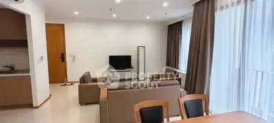 Spacious modern living room with open kitchen and elegant furnishings