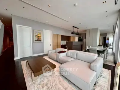 Luxurious modern living room with sleek furniture and open layout in high-end apartment.