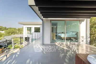 Modern luxury home with spacious balcony and glass sliding doors