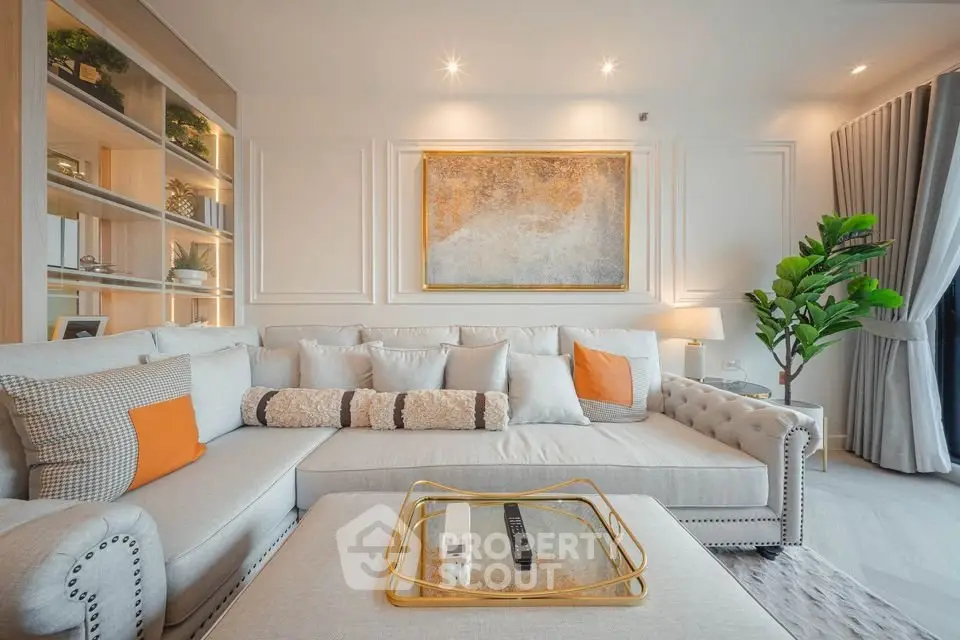 Luxurious living room with elegant decor and plush seating in a modern apartment.