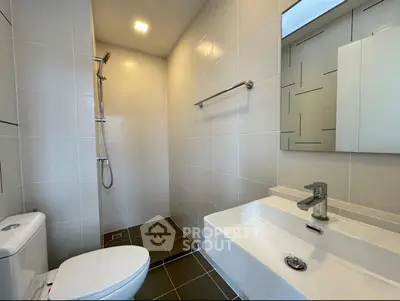 Modern bathroom with sleek fixtures and walk-in shower design.