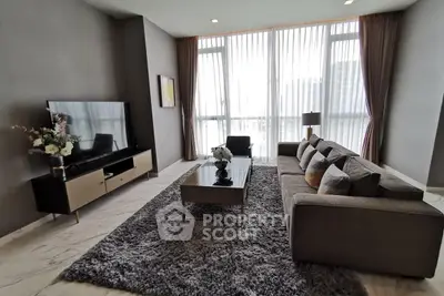 Modern living room with large windows and stylish decor