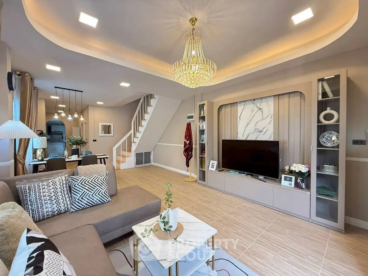 Luxurious living room with elegant chandelier and modern decor