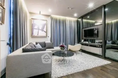 Modern living room with stylish decor, cozy seating, and elegant lighting for a luxurious ambiance.