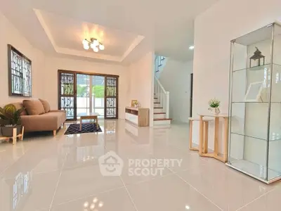 Spacious modern living room with elegant decor and natural light.