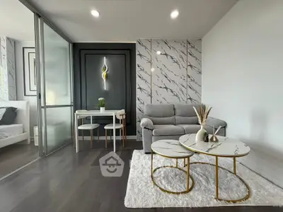 Modern living room with marble accents and cozy seating area