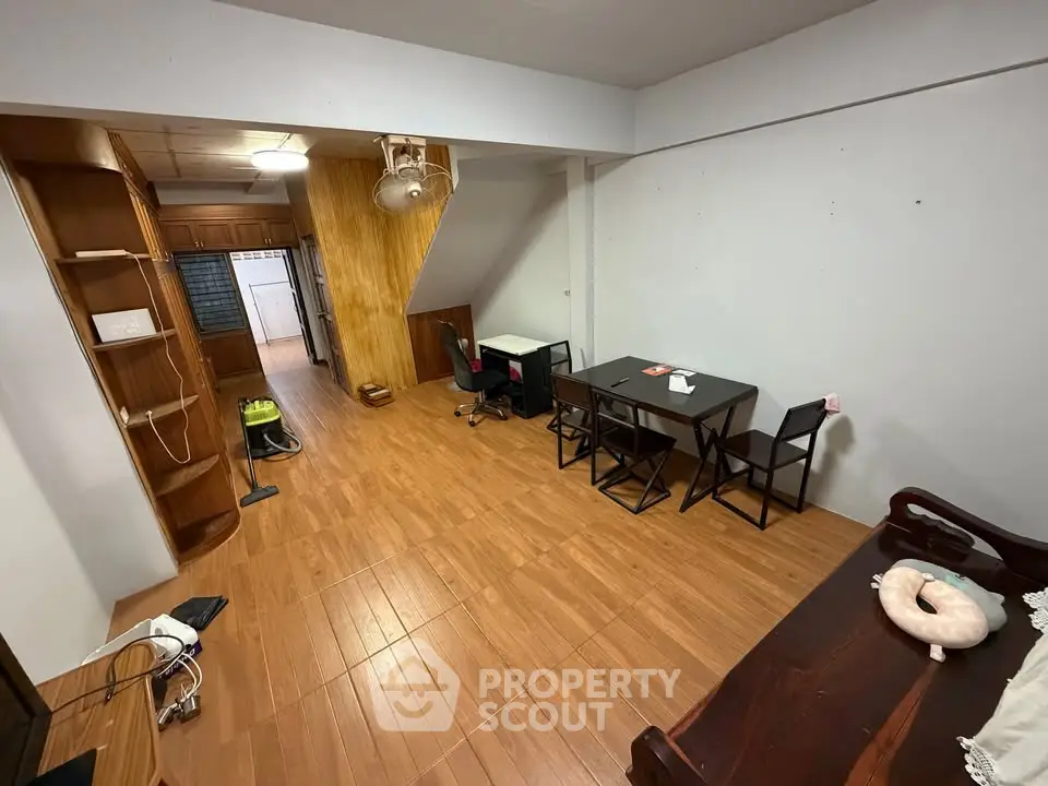 Spacious living room with wooden flooring and modern furniture