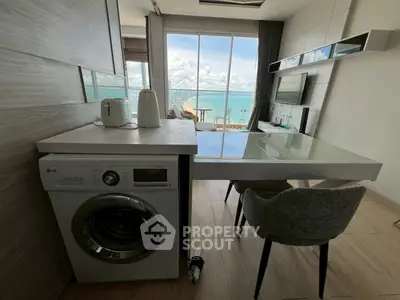 Modern living room with ocean view and in-unit washing machine