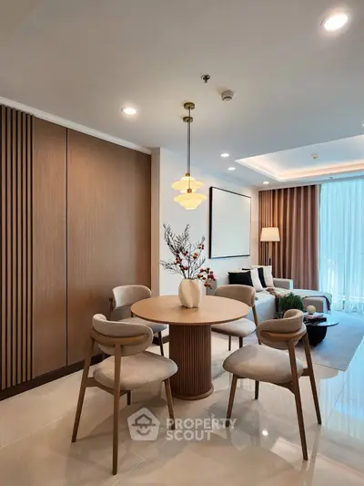 Modern living room with elegant dining area and stylish decor
