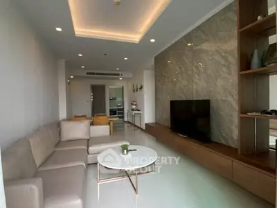 Modern living room with stylish decor and comfortable seating in a contemporary apartment.