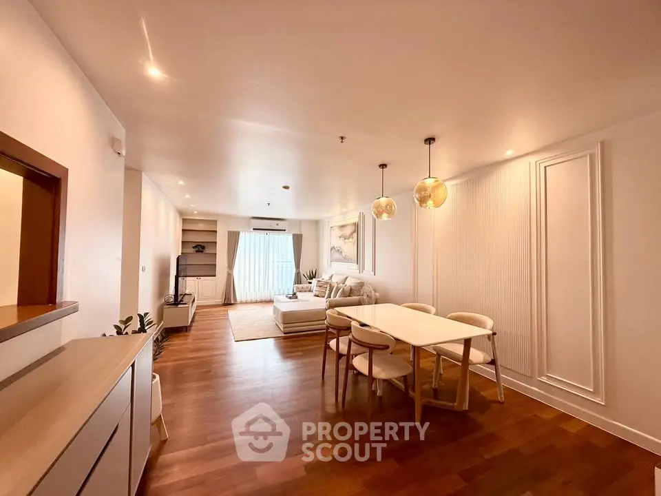 Spacious modern living room with elegant dining area and stylish lighting