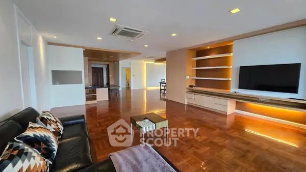 Spacious modern living room with sleek design and wooden flooring