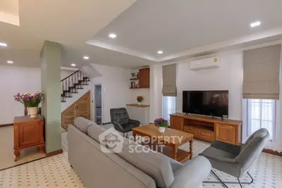 Spacious living room with modern decor and cozy seating area