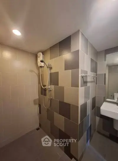 Modern bathroom with stylish tile design and sleek fixtures