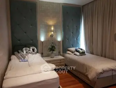 Luxurious bedroom with elegant decor and plush bedding, perfect for relaxation and comfort.