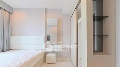 Modern minimalist bedroom with sleek furniture and soft lighting