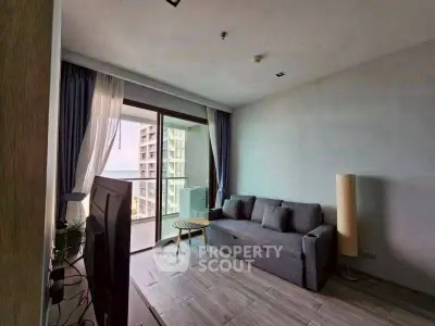 Modern living room with balcony view in high-rise apartment