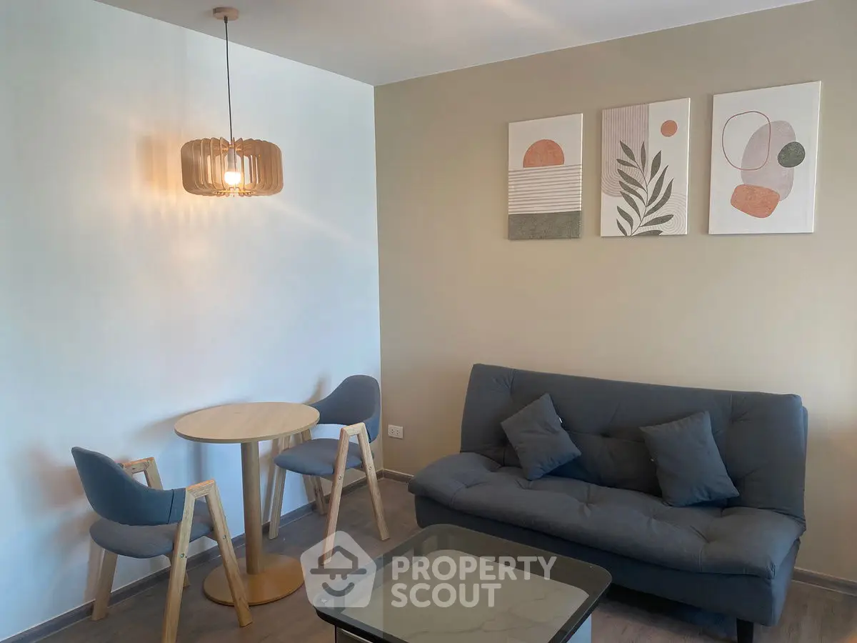 Modern living room with stylish furniture and contemporary wall art.