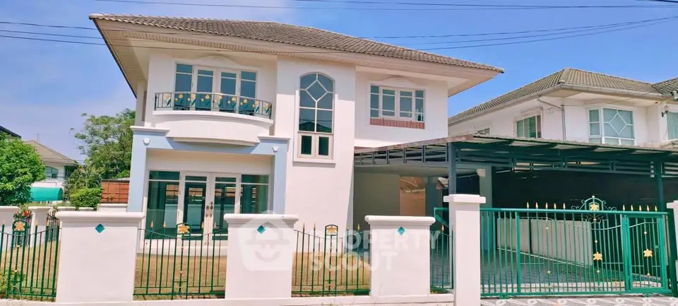 Charming two-story house with elegant facade and spacious front yard in a serene neighborhood.