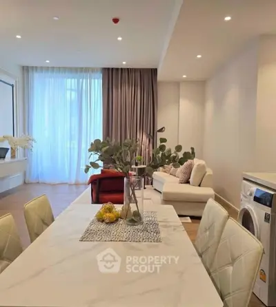 Spacious modern living room with elegant dining area and natural light