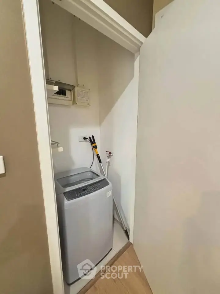 Compact laundry area with modern washing machine in a cozy apartment