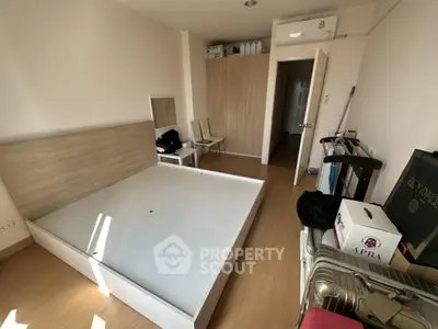 Spacious bedroom with modern furniture and ample storage space