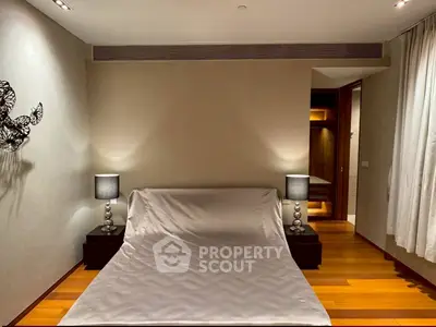 Luxurious bedroom with elegant decor and ambient lighting