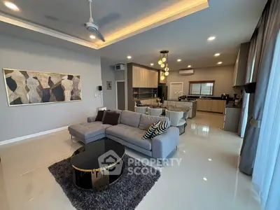 Spacious modern living room with open kitchen and elegant decor