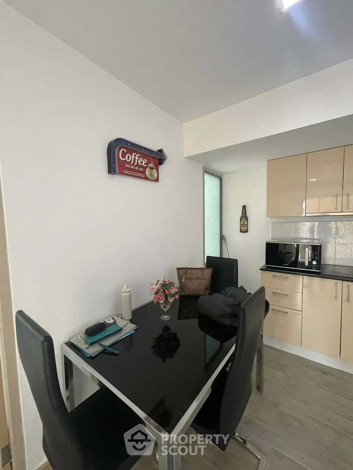 Modern kitchen with sleek black dining table and stylish decor