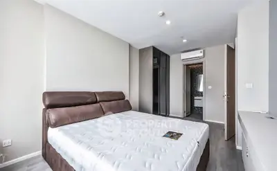 Modern bedroom with stylish decor and built-in wardrobe in a contemporary apartment.