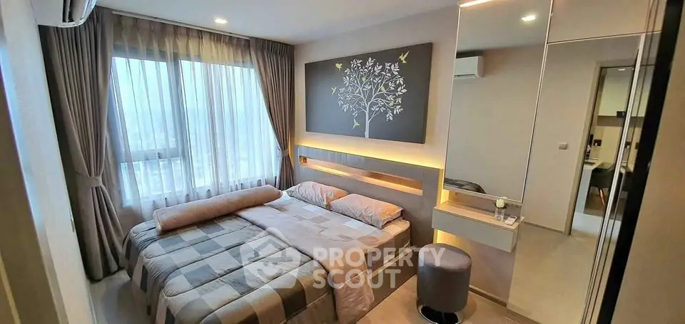 Cozy modern bedroom with stylish decor and large window view