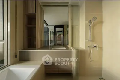 Modern bathroom with sleek design, featuring a bathtub and elegant shower area.