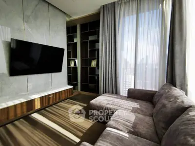 Luxurious living room with modern TV setup and elegant furnishings