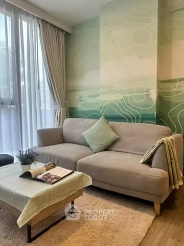 Cozy living room with stylish sofa and modern decor, perfect for relaxation and entertaining.