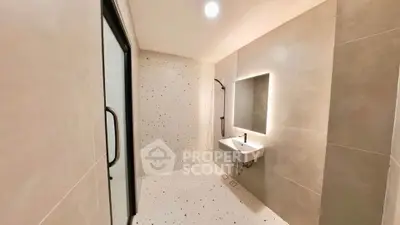 Modern minimalist bathroom with sleek design and ambient lighting